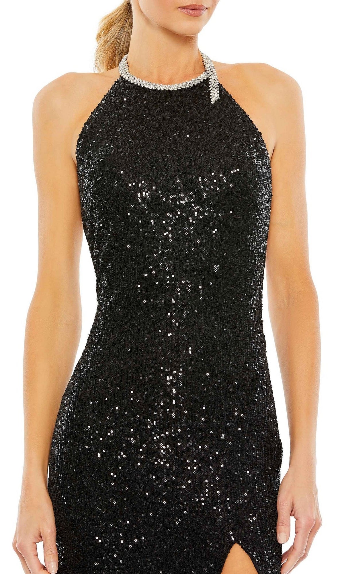 A woman wearing the Long Formal Dress 26943 by Mac Duggal, a fitted sequin halter gown with a rhinestone neckline, sleeveless cut, and open back design.